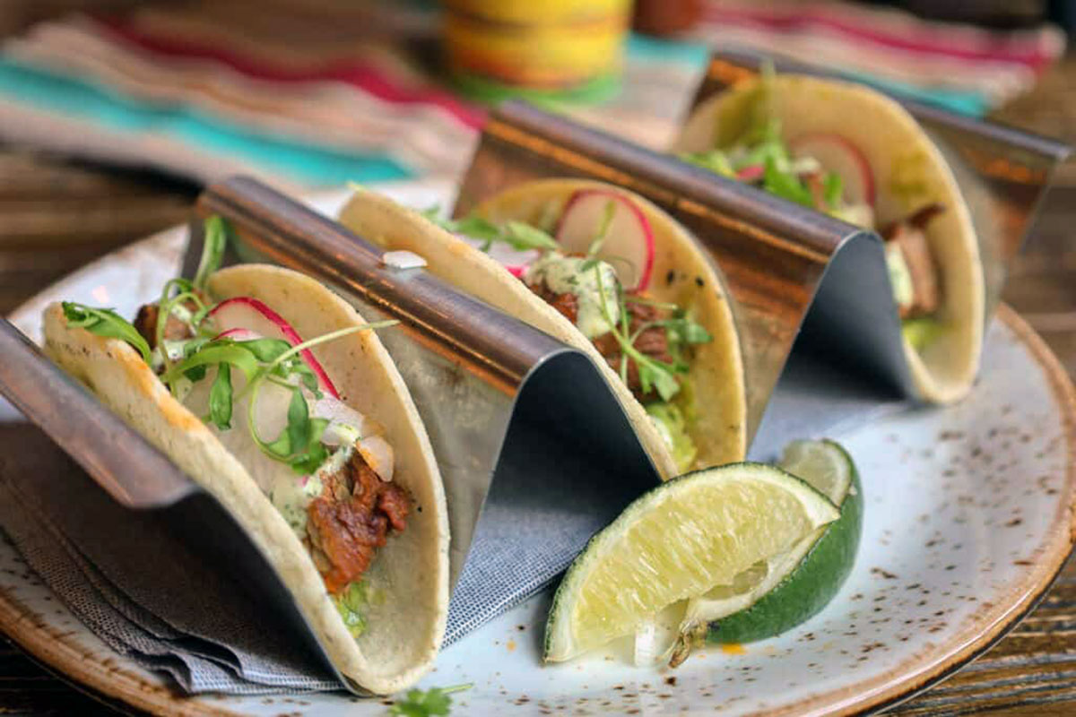 Birria tacos — Beef, onions, cilantro, sliced radishes, corn tortilla